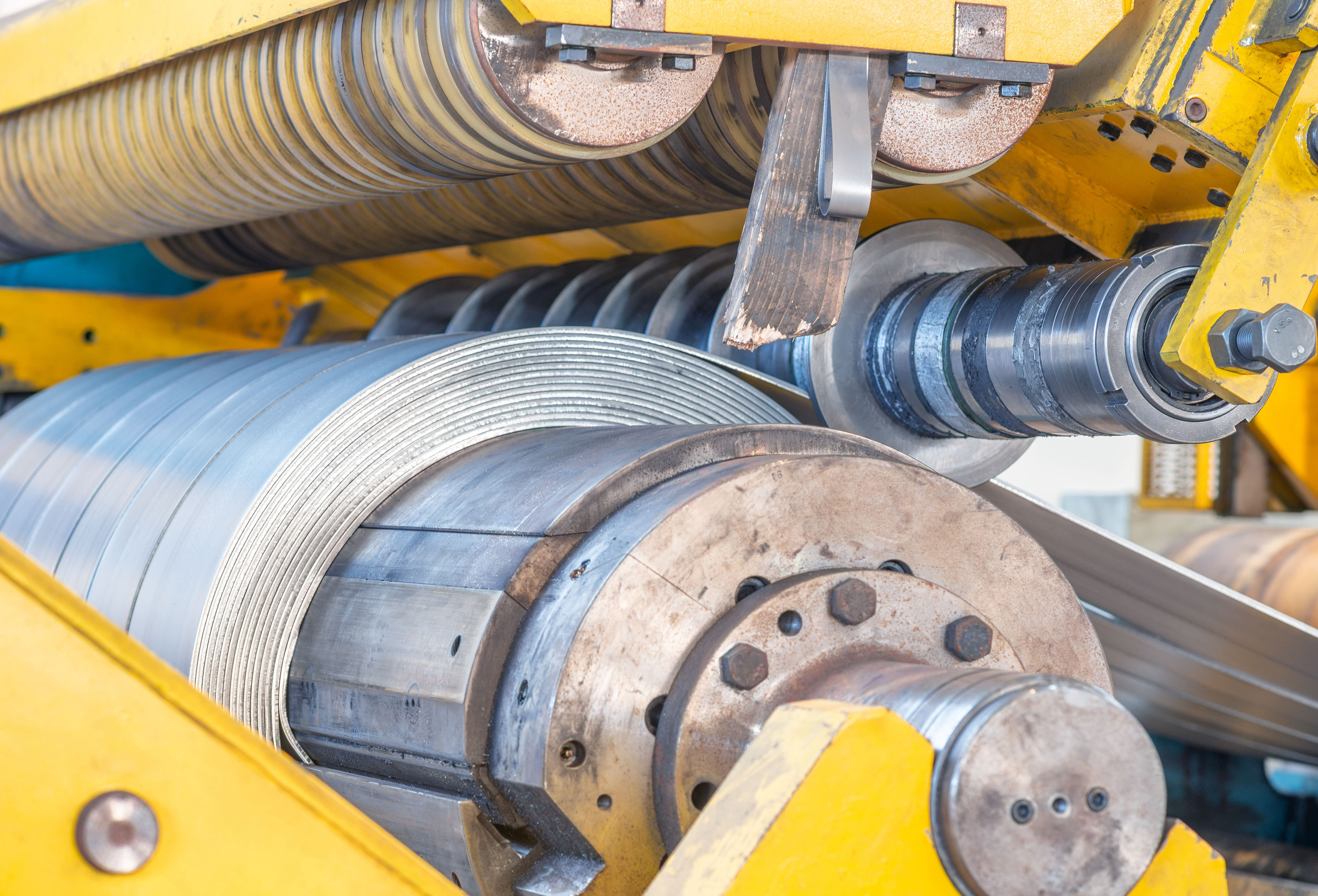 Roll of galvanized steel sheet at cutting machine